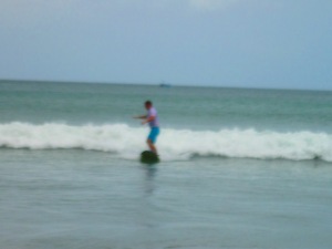 surfing at Remanso Beach by San Juan del Sur